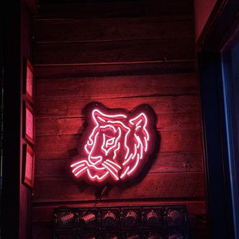 Teton Tiger - a neon tiger on a wooden wall - Pan Asian Near Me - Jackson, Wyoming Teton Tiger - a neon tiger on a wooden wall - Pan Asian Near Me - Jackson, Wyoming