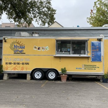 Nyam Sunshine Cuisine - Outside of truck next to beer hall - Food Trucks Near Me - Austin, Texas Nyam Sunshine Cuisine - Outside of truck next to beer hall - Food Trucks Near Me - Austin, Texas