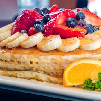 Mark's Finer Diner - a stack of pancakes with fruit on top - Diners Near Me - Omemee, Ontario