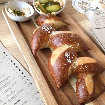 Wursthall - Pull apart pretzel with black pepper honey butter and Bavarian cheese spread and pickles - German Near Me - San Mateo, California
