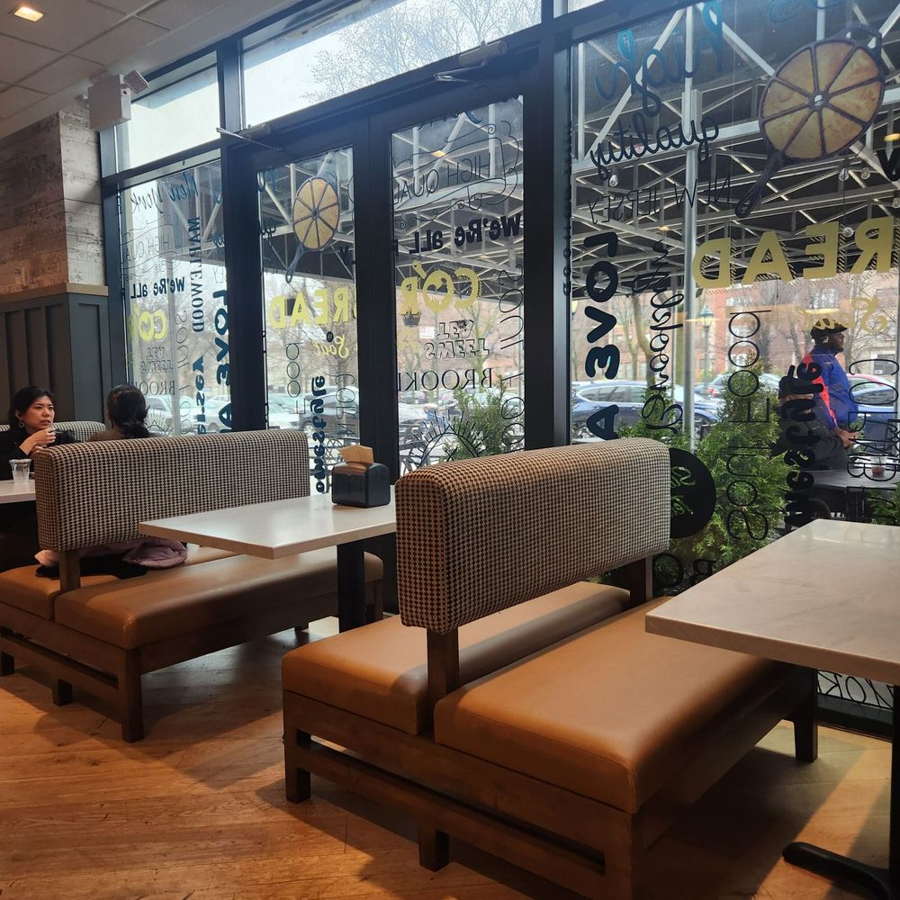 Cornbread Brooklyn - Indoor seating with a glimpse of the outdoor dining area - Soul Food Near Me - Brooklyn, New York Cornbread Brooklyn - Indoor seating with a glimpse of the outdoor dining area - Soul Food Near Me - Brooklyn, New York