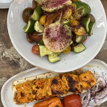 Delbar Middle Eastern - Tomato heirloom salad at the top. Chicken kebab at the bottom. - Persian/Iranian Near Me - Atlanta, Georgia Delbar Middle Eastern - Tomato heirloom salad at the top. Chicken kebab at the bottom. - Persian/Iranian Near Me - Atlanta, Georgia