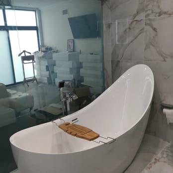 AIS Repairs & Renovations - Our amazing tub. With the transparency glass behind it (as you can see in the other pics you can make this glass non-transparent) - General Contractors Near Me