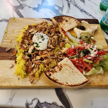 Shawarma Time - Chicken shwarma plate with hummus saffron rice salad and warm pita. - Kebab Near Me - Redmond, Washington Shawarma Time - Chicken shwarma plate with hummus saffron rice salad and warm pita. - Kebab Near Me - Redmond, Washington