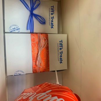 Tiff's Treats - an orange bag with a blue ribbon tied to it - Desserts Near Me - Houston, Texas Tiff's Treats - an orange bag with a blue ribbon tied to it - Desserts Near Me - Houston, Texas