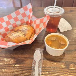 Grilled cheese and tasteless broth soup in cardboard