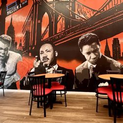 Why use BK bridge in the background for a Harlem franchise? Why place Denzels' iteration of a drug dealer, next to prominent black leaders?