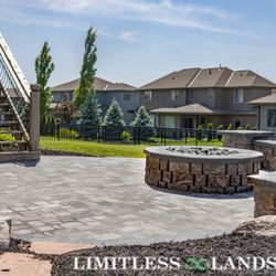 Limitless Landscape - Backyard Patio with Seating wall, Gas Fireplace all matching materials.