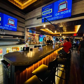 Pleasant Bar - people sitting at the bar and watching televisions - Sports Bars Near Me - Pittsburgh, Pennsylvania