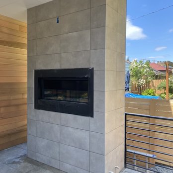 Pro Floors and Walls - a fireplace in a modern home - Tiling Near Me Pro Floors and Walls - a fireplace in a modern home - Tiling Near Me