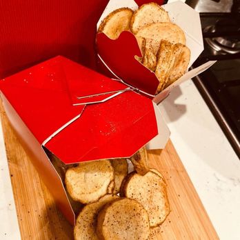 Good Good Chicken - a box of crackers on a cutting board - Food Stands Near Me Good Good Chicken - a box of crackers on a cutting board - Food Stands Near Me
