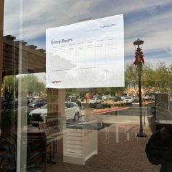 Verizon - Door with hours but location is closed during business hours posted.