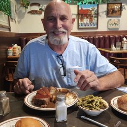 My Edward smiling. He ordered the meatloaf with mashed potatoes witg gravy and a side of pesto pasta.