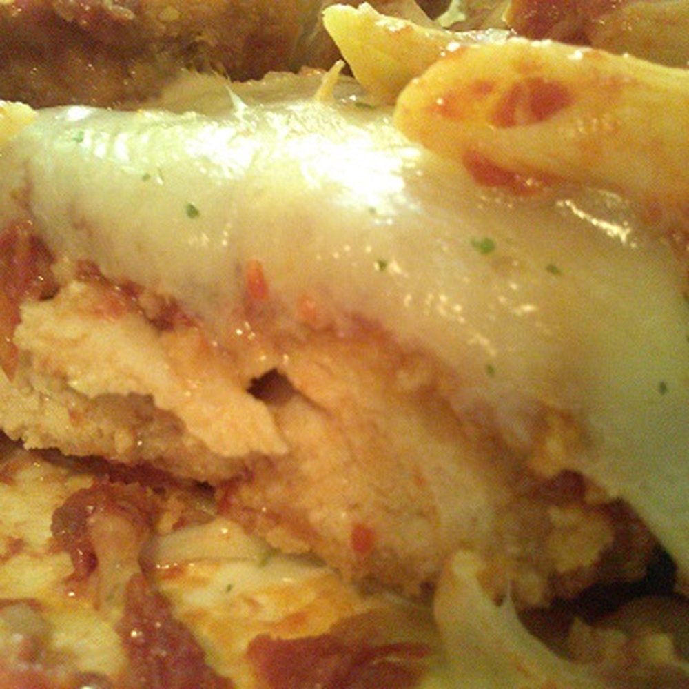 Newburg Deli - Cut open the Chicken Parmesan breast to show you the breading coat under the cheese. - Caterers Near Me - Nazareth, Pennsylvania Newburg Deli - Cut open the Chicken Parmesan breast to show you the breading coat under the cheese. - Caterers Near Me - Nazareth, Pennsylvania