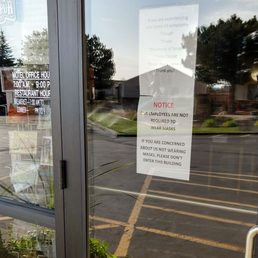 Sign advertising that employees do not wear masks despite pandemic. Sign advertising that employees do not wear masks despite pandemic.
