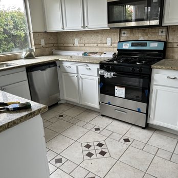 Juan Construction Handyman - After a Juan transformed it with detailed cabinet painting and installing new appliances. - Handyman Near Me