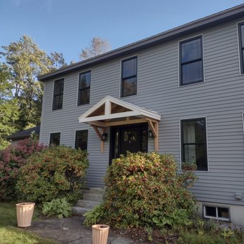 R N E Renovators - The homeowner wanted to add a Portico to the front of the home to bring more shape. It is a big rectangular house that needed more detail. - General Contractors Near Me - Putney, Vermont