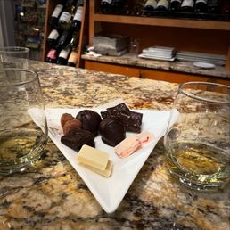 Four 2 oz Wines, four chocolate pieces, a Chocolate Dipped Strawberry and a Cabernet Wine Truffle Four 2 oz Wines, four chocolate pieces, a Chocolate Dipped Strawberry and a Cabernet Wine Truffle