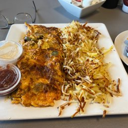Mexican omelette, overcooked. Bottom side worse.  Toast was black. Scraped off the char using a knife.