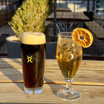 Flock of Moons Brewing - a glass of beer and a glass of orange juice - Brewpubs Near Me - Albuquerque, New Mexico Flock of Moons Brewing - a glass of beer and a glass of orange juice - Brewpubs Near Me - Albuquerque, New Mexico
