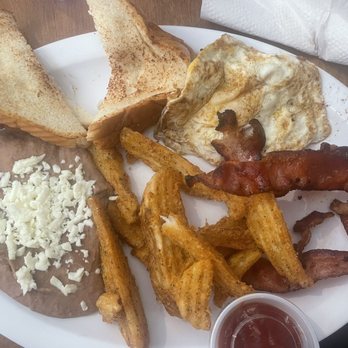 King Burrito - The platter, beans, wedges, bacon, eggs and toast - Mexican Near Me - Saint Louis, Missouri King Burrito - The platter, beans, wedges, bacon, eggs and toast - Mexican Near Me - Saint Louis, Missouri
