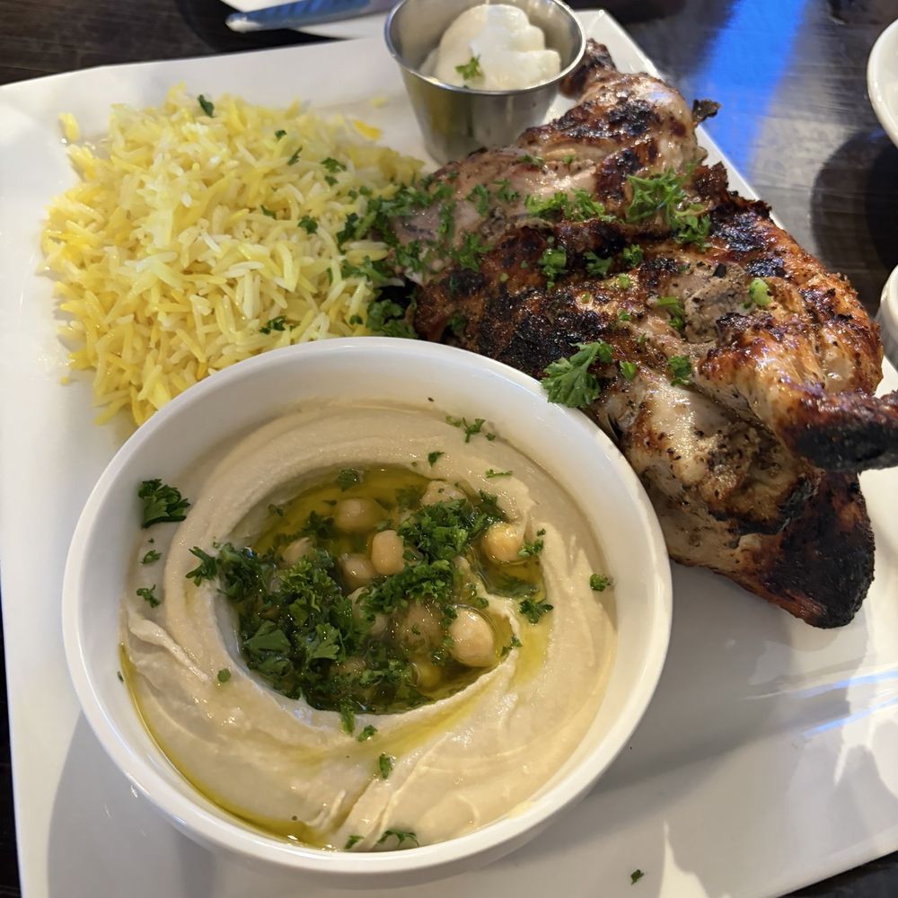 Baba Ali Grill - Half a marinated chicken with basmati, rice, hummus, and garlic - Mediterranean Near Me - Murrieta, California Baba Ali Grill - Half a marinated chicken with basmati, rice, hummus, and garlic - Mediterranean Near Me - Murrieta, California