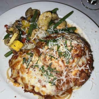 Macaluso's Italian Restaurant - Chicken Parmesan with sautéed vegetables - Italian Near Me - Ruston, Washington Macaluso's Italian Restaurant - Chicken Parmesan with sautéed vegetables - Italian Near Me - Ruston, Washington
