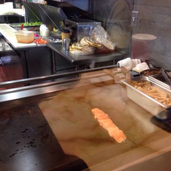Petit Café - Salmon Kabob on the grill - Greek Near Me - El Segundo, California Petit Café - Salmon Kabob on the grill - Greek Near Me - El Segundo, California