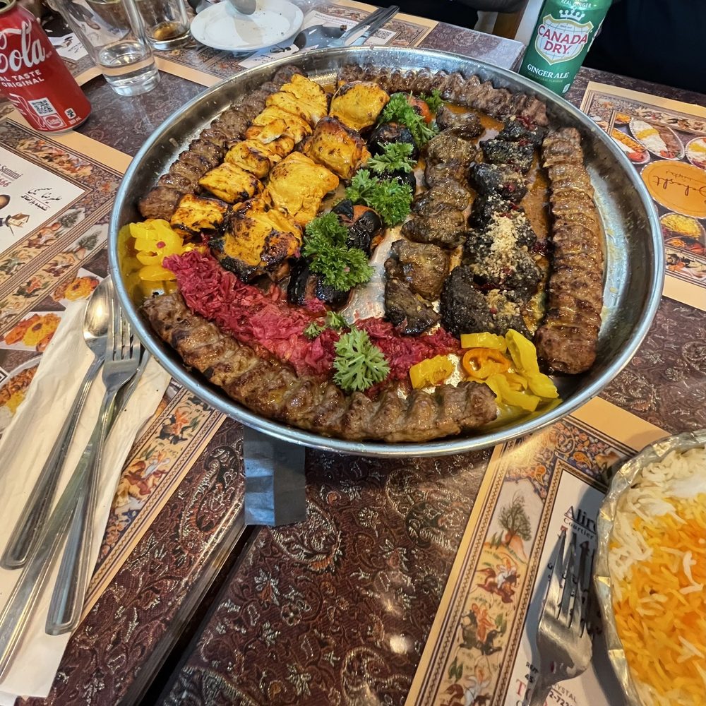 Behesht - The fantastic family platter - Kabob Assortment with grilled tomatoes and pickles cabbage. - Persian/Iranian Near Me - Montreal, Quebec Behesht - The fantastic family platter - Kabob Assortment with grilled tomatoes and pickles cabbage. - Persian/Iranian Near Me - Montreal, Quebec