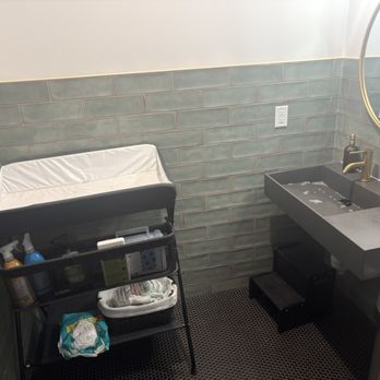Uprise Chiropractic - Restroom equipped with changing table, spare diapers, and other essentials. - Chiropractors Near Me - Dallas, Texas Uprise Chiropractic - Restroom equipped with changing table, spare diapers, and other essentials. - Chiropractors Near Me - Dallas, Texas