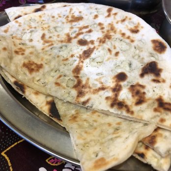 Indian Village Eatery - Plain and garlic naan~ - Indian Near Me - Vancouver, British Columbia Indian Village Eatery - Plain and garlic naan~ - Indian Near Me - Vancouver, British Columbia