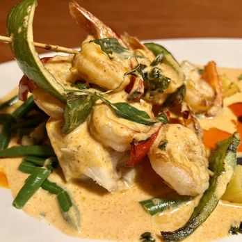 Thai Thani - Pan Pan-Seared Sea Bass and Grilled Shrimp in a light red curry sauce. - Thai Near Me - Orlando, Florida