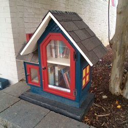The Red Canvas - Book exchange in front of store