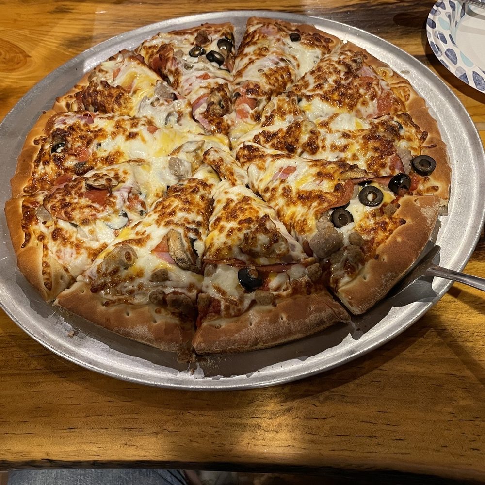 Bedroom Goldmine Bar - a pizza with olives and cheese - Bars Near Me - Murray, Idaho