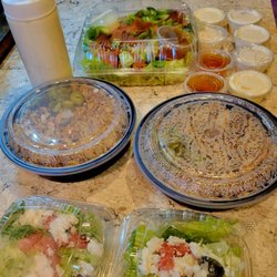 Venus - 2 chicken shawarma platters with side salads, fatoosh salad, and large garlic sauce