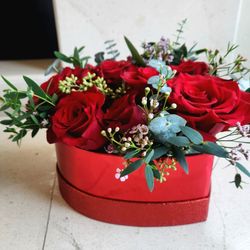 "A beautiful heart-shaped rose arrangement made with love"