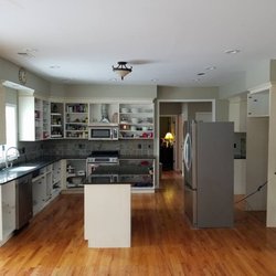 Oceanside Painting & Refinishing - Stage 2 showing the kitchen after its final coat of paint. Notice how all glasses and dishes stayed in place!
