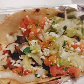 Calle Tepa - Carne asada on corn tepa style- shredded lettuce, Pico and cotija crumbles. - Mexican Near Me - Tucson, Arizona
