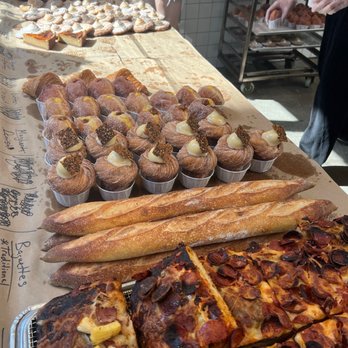 Supermoon Bakehouse - Black sesame tahini cruffin (to the left of the baguettes) - Bakeries Near Me - New York, New York Supermoon Bakehouse - Black sesame tahini cruffin (to the left of the baguettes) - Bakeries Near Me - New York, New York