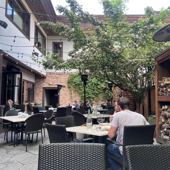 Abruzzo Italian Kitchen - Outside patio tucked in the back! - Italian Near Me - Whitefish, Montana