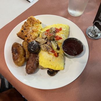 Water for Chocolate - Stuffed omelet: potatoes, cornbread (choice turkey sausage) - Breakfast & Brunch Near Me - Baltimore, Maryland Water for Chocolate - Stuffed omelet: potatoes, cornbread (choice turkey sausage) - Breakfast & Brunch Near Me - Baltimore, Maryland