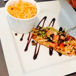 Grilled atlantic salmon with a lemon and fennel condementi with a carrot and corn salad