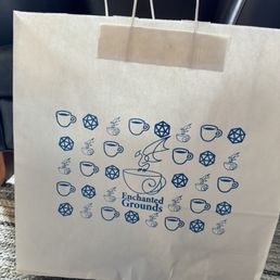 Bag of goodies I walked out of the shop with (two board games and a dragon to take home and paint)