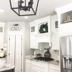 Home Stone Granite - The granite is called "White Ice." It has white, gray and a little black in it. The edge featured here is 'Square cut."