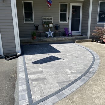 Bayside Landscaping - a patio with flags and flags - Landscaping Near Me - Bristol, Rhode Island