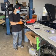 Photo of EVFixMe - Costa Mesa, CA, United States. Eddy comparing the N2itive camber arm vs factory camber arm