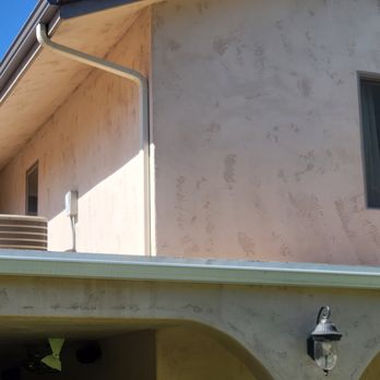 Urban Tech - Downspout placed on side wall so as to not be as noticeable look directly at back of house. - Gutter Services Near Me
