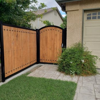Spence Fence - powder coated black iron frame w/ wood face gate w/ key pad entry - Fences & Gates Near Me - Visalia, California