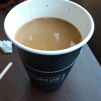 Second Cup - a cup of coffee on a table - Coffee & Tea Near Me - Quebec City, Quebec