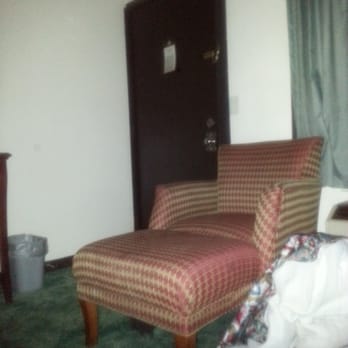 Value Inn - Milwaukee South - Entry way with the chair plagued with cigarette burn holes - Hotels Near Me - Oak Creek, Wisconsin
